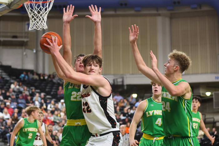 Zillah's Nic Navarre is defended by a pair of Lynden players during Thursday night's game at the SunDome Shootout in Yakima, Wash.